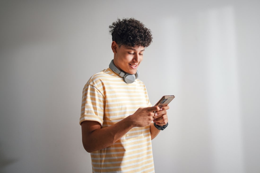 Young man looking at phone.
