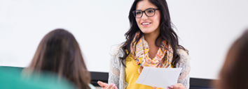 Student speaking in English in a lecture