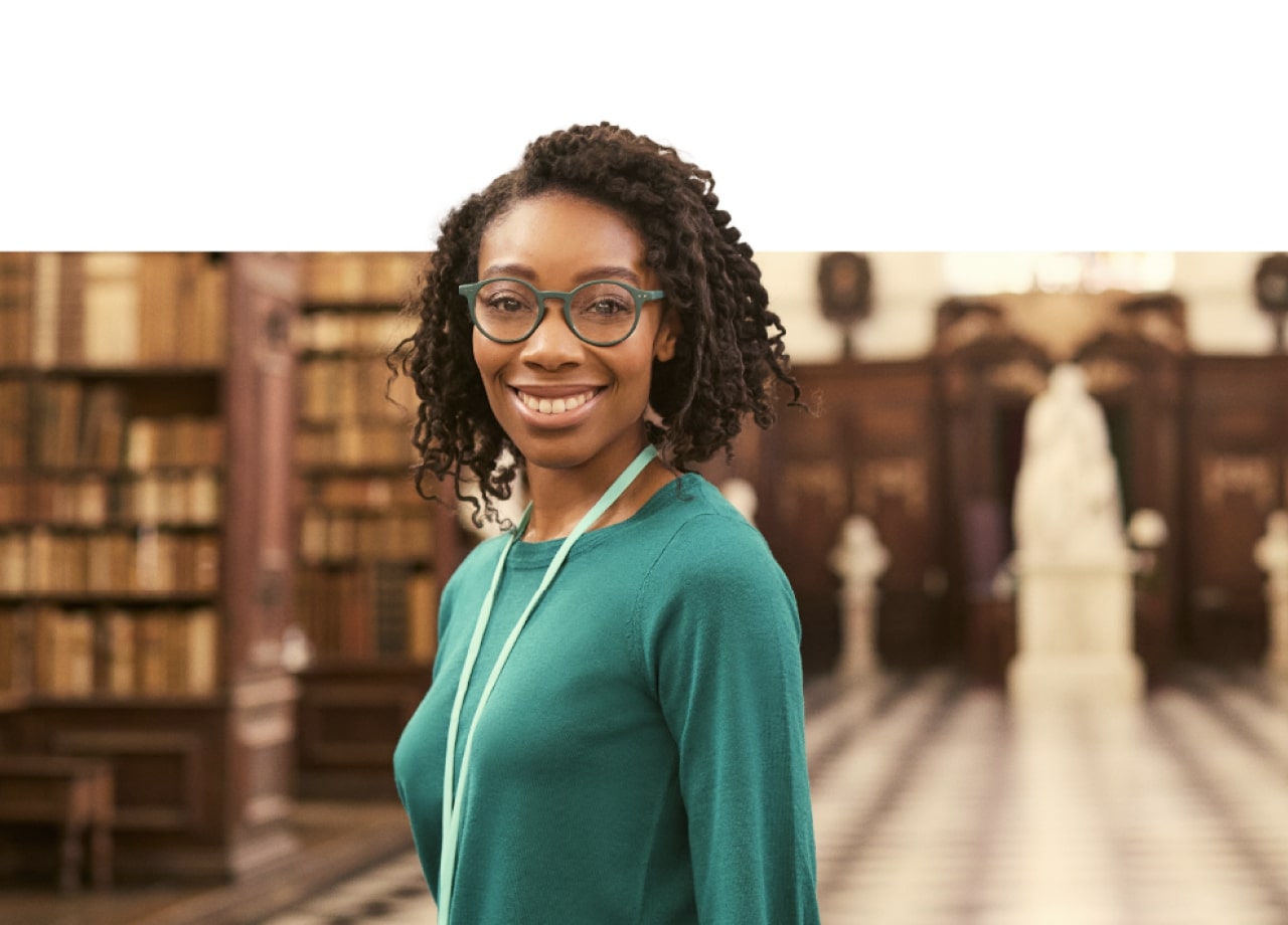 Woman with glasses in library.